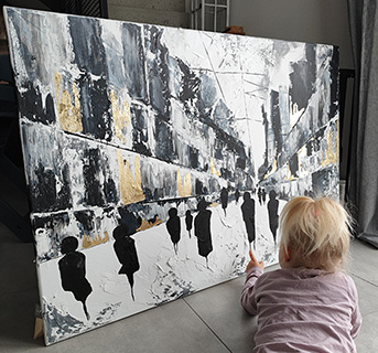 Image of museum exhibit featuring sculpture and prints of abstract art in mostly orange and turquoise colors